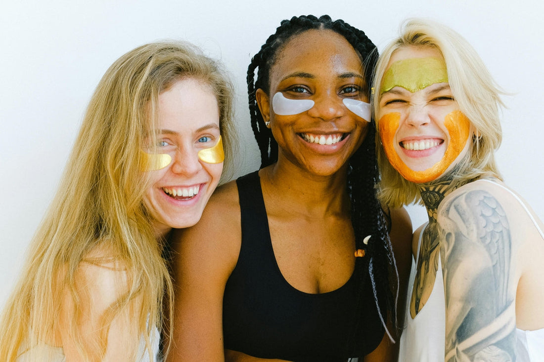 "Three smiling women with different hair colours and healthy skin tones, showcasing biotin's role in maintaining healthy skin.