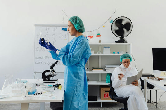 two women analysing samples and reading research notes in a laboratory β study on coenzyme q10 300mg and heart health