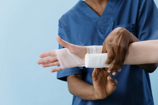 nurse applying bandage to arm to support wound healing – illustrates role of l-lysine in tissue repair and skin recovery