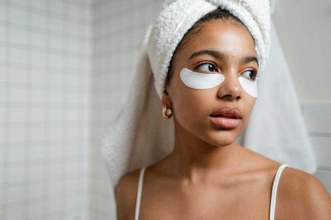 Woman with a towel on her head and glowing skin, highlighting the benefits of nutritional supplements for skin health.