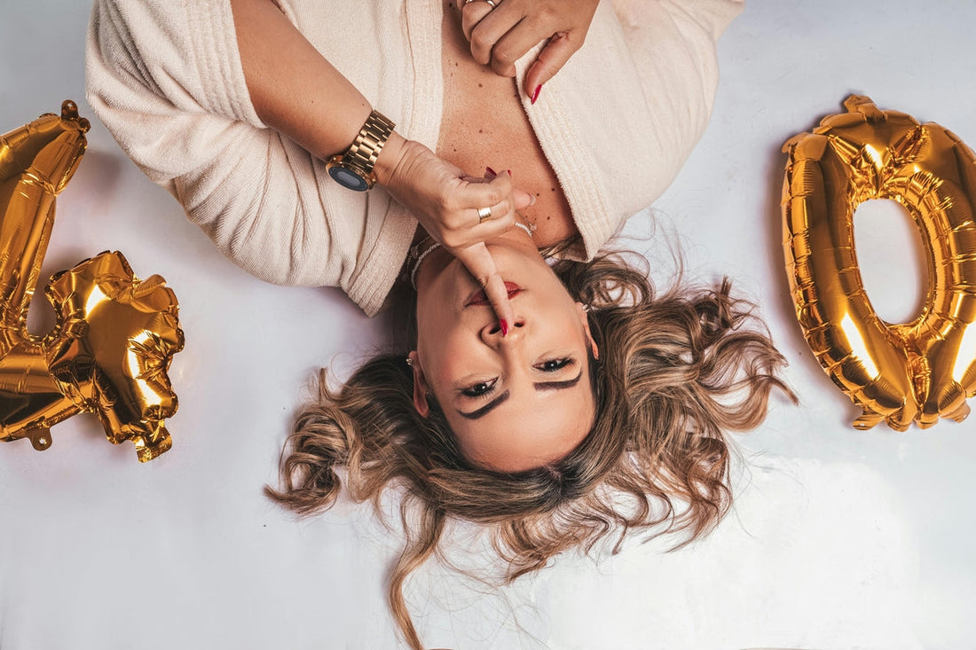 woman celebrating 40th birthday with golden balloons – symbol of vitality and hormonal balance after 40 with ashwagandha
