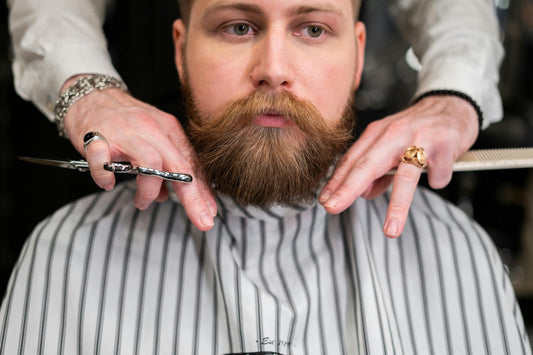 man with well-groomed beard at barber shop – biotin benefits for beard growth and men's skin health
