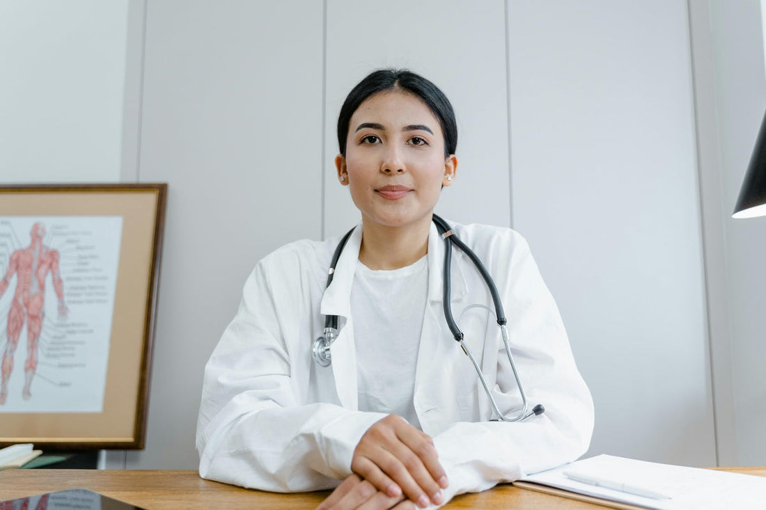 female doctor with stethoscope and anatomy graphic – representing methyl folate and fertility support for women